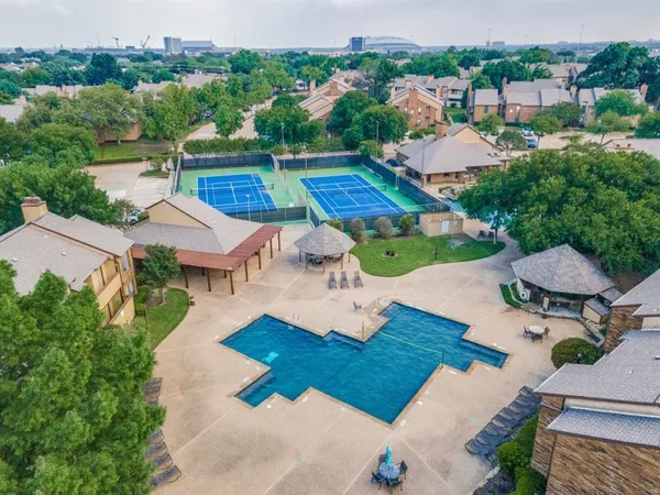 an aerial view of a house with pool lake view and mountain view