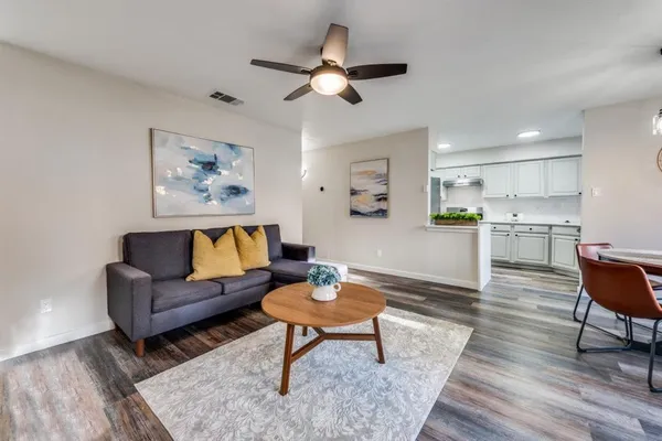 a living room with furniture and a rug