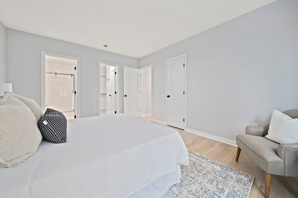 192 Allerton Commons Lane, Unit 192 Braintree, MA 02184 - Photo 11 of 17 a bedroom with a bed and furniture