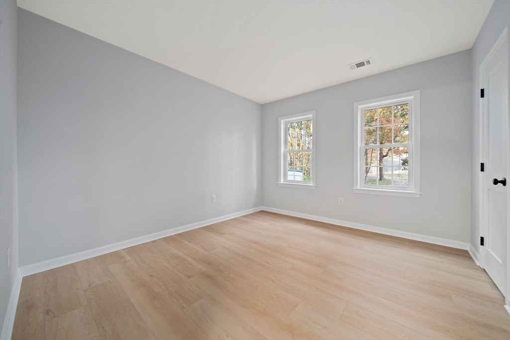 192 Allerton Commons Lane, Unit 192 Braintree, MA 02184 - Photo 12 of 17 a view of an empty room with a window