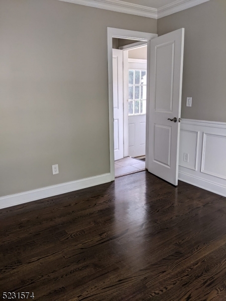 155 Locust Drive Union, NJ 07083 - Photo 11 of 24 an empty room with wooden floor and windows