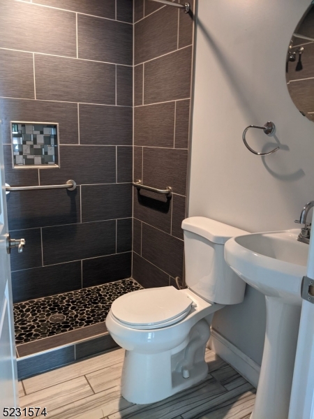 155 Locust Drive Union, NJ 07083 - Photo 15 of 24 a bathroom with a toilet and a sink