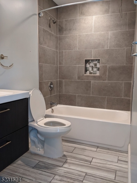 155 Locust Drive Union, NJ 07083 - Photo 16 of 24 a bathroom with a toilet a sink and bathtub