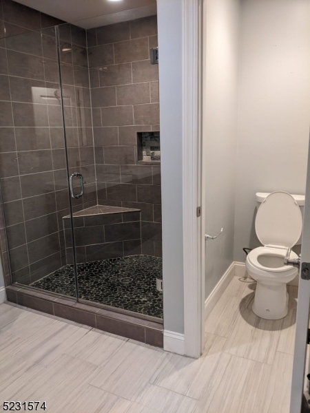 155 Locust Drive Union, NJ 07083 - Photo 17 of 24 a bathroom with a toilet and a shower