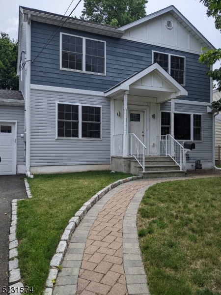 155 Locust Drive Union, NJ 07083 - Photo 24 of 24 a front view of a house with garden