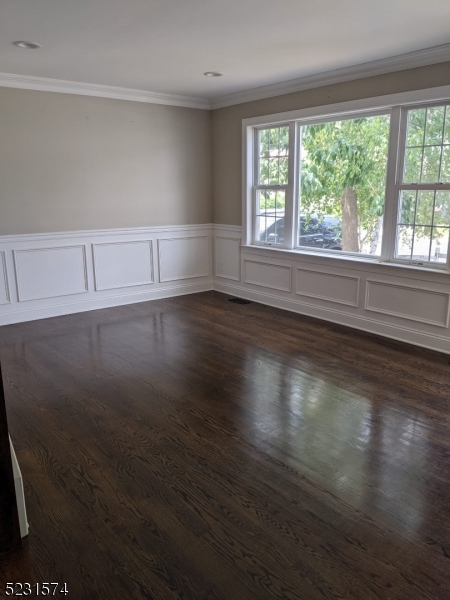 155 Locust Drive Union, NJ 07083 - Photo 8 of 24 an empty room with wooden floor and windows