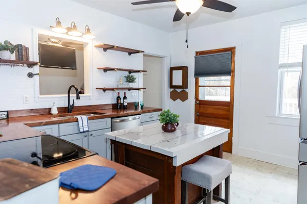 a kitchen with a table and chairs in it