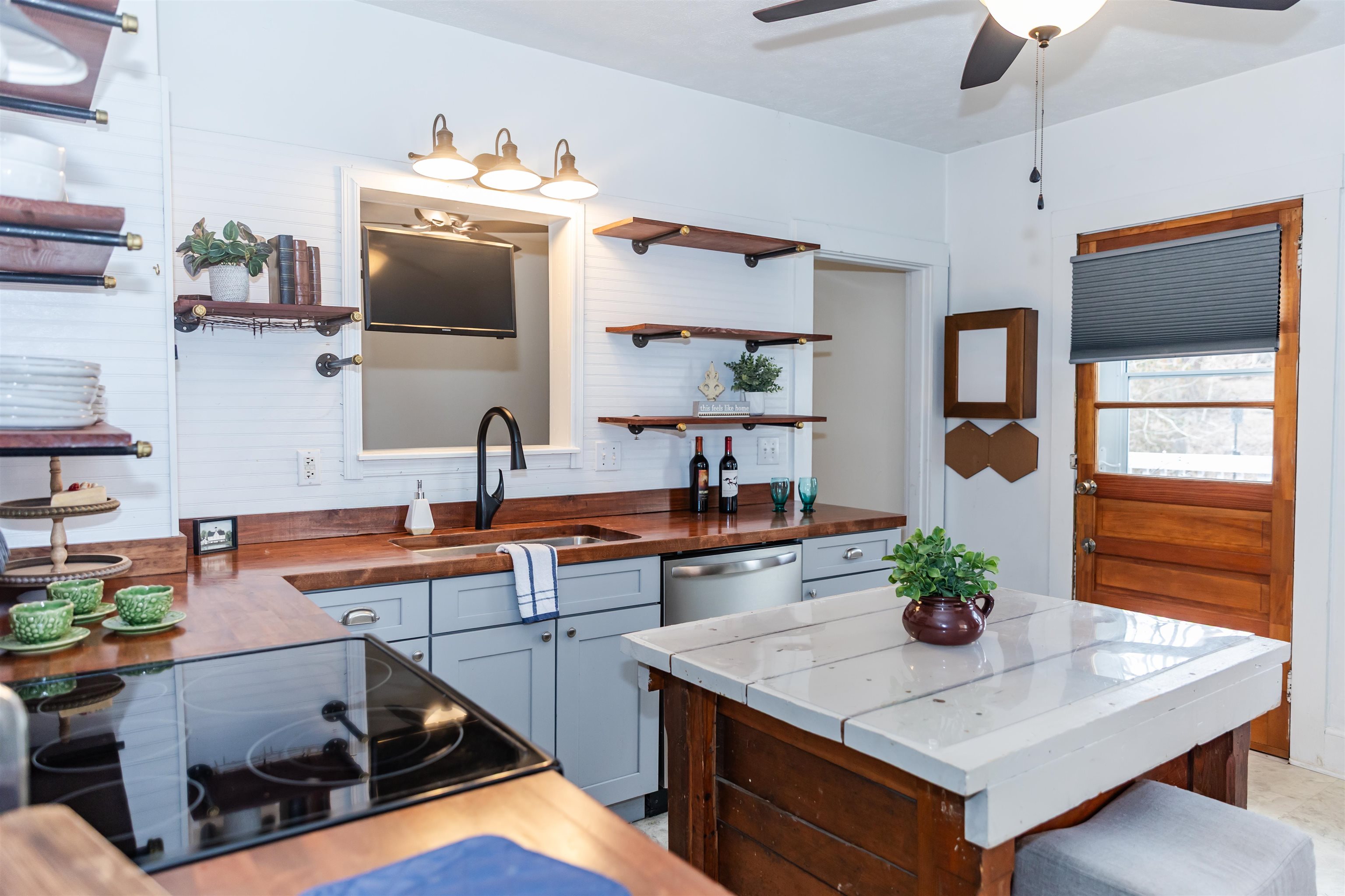 713 Thorn Hill Road Lexington, VA 24450 - Photo 12 of 45 a kitchen with stainless steel appliances a stove a sink and a microwave