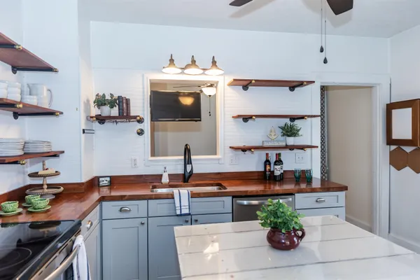 a kitchen with a sink and cabinets