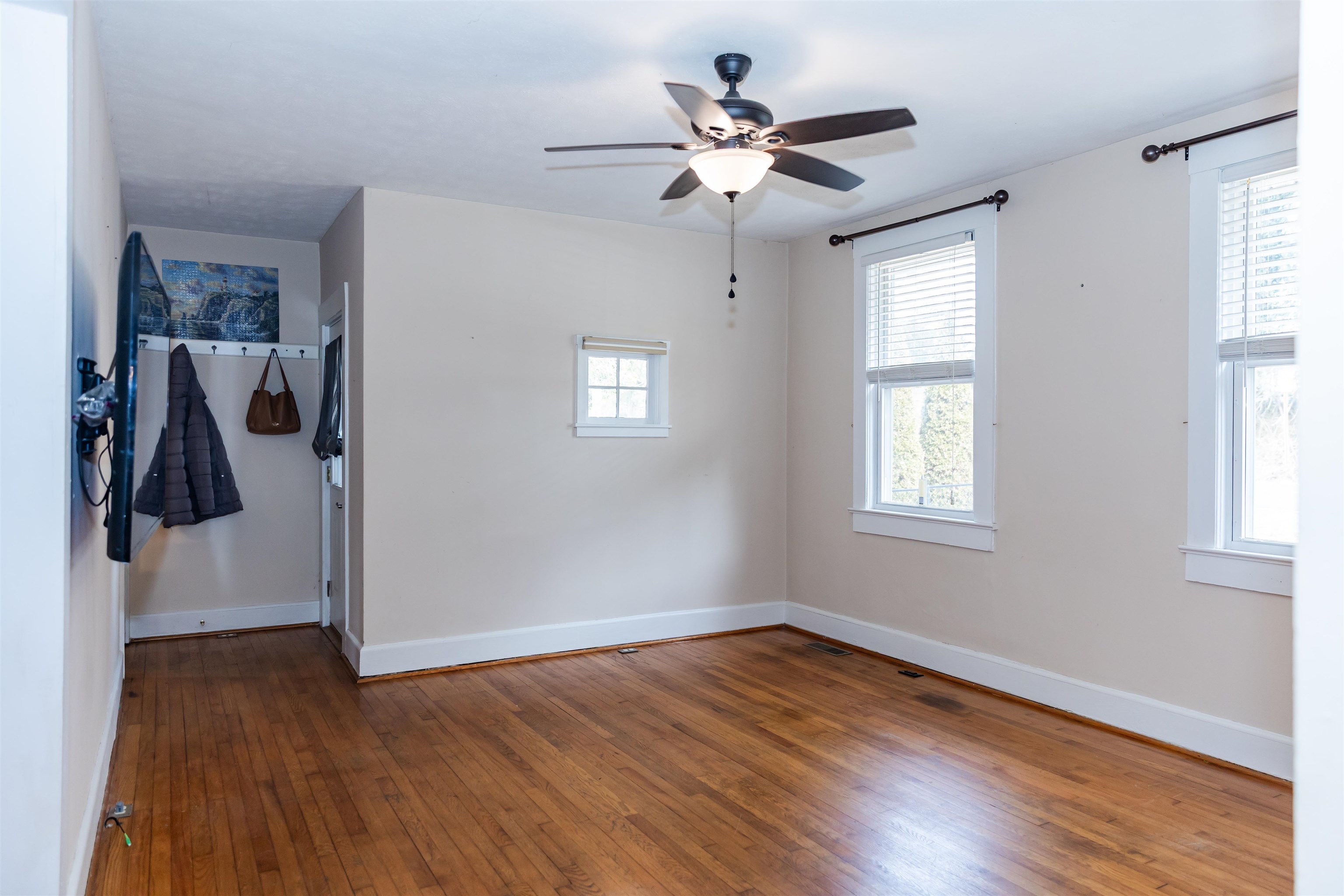 713 Thorn Hill Road Lexington, VA 24450 - Photo 15 of 45 wooden floor in an empty room with a window