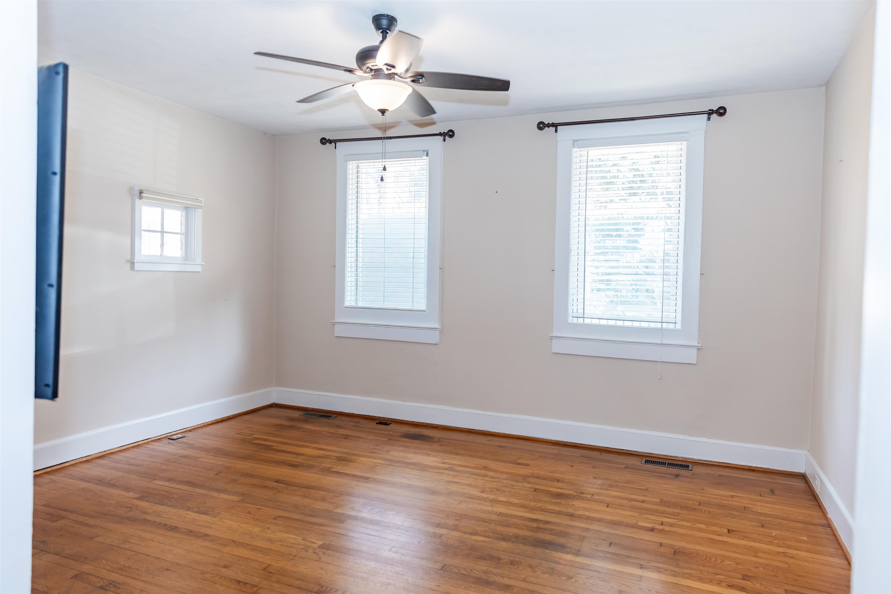 713 Thorn Hill Road Lexington, VA 24450 - Photo 22 of 45 a view of empty room with wooden floor and fan