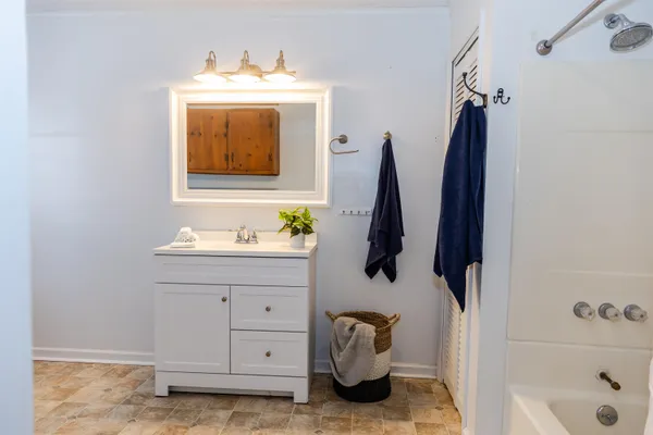 a bathroom with a sink and a bathtub