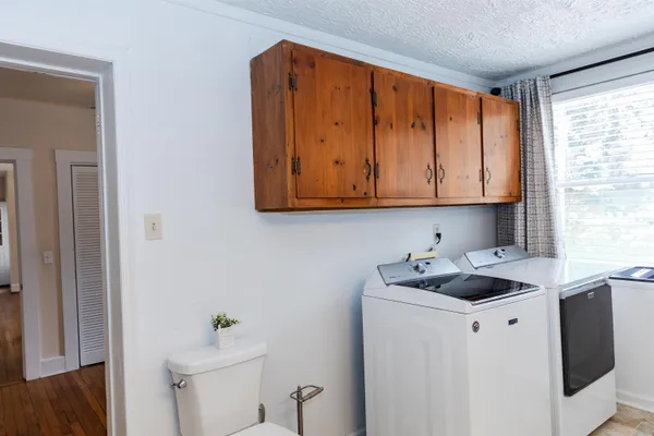 a kitchen with a sink cabinets and a window