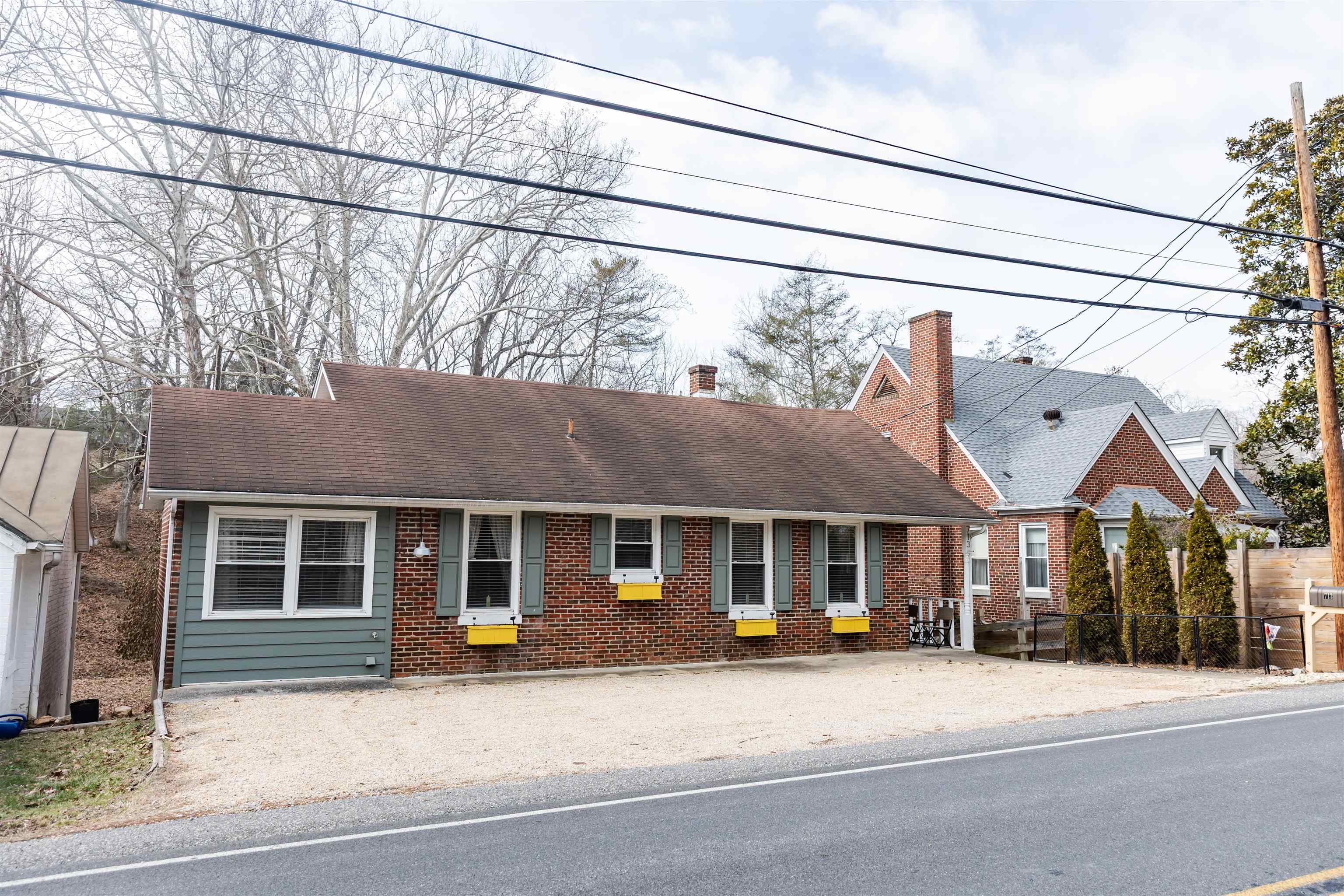 713 Thorn Hill Road Lexington, VA 24450 - Photo 3 of 45 a front view of a house with a garage