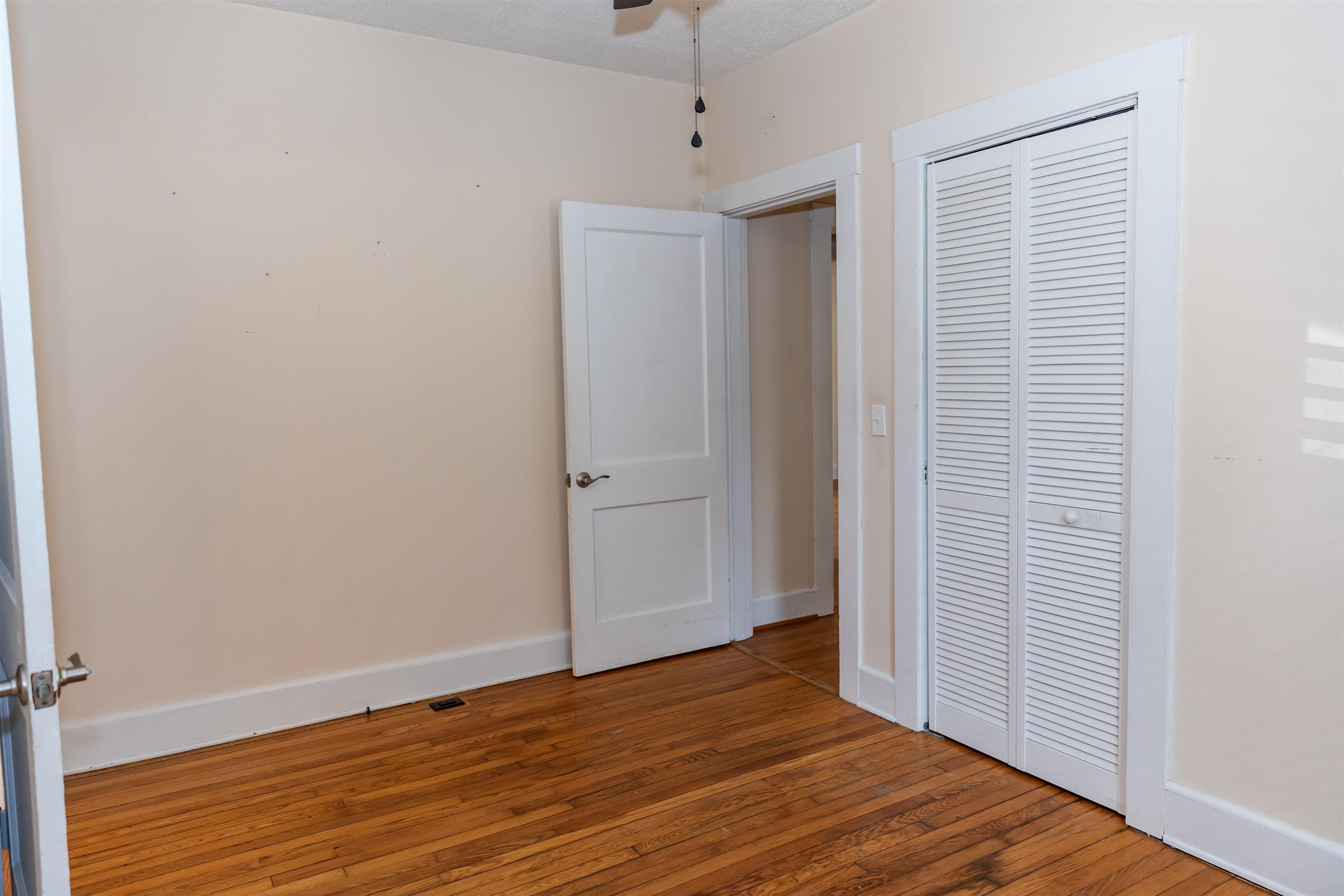 713 Thorn Hill Road Lexington, VA 24450 - Photo 32 of 45 a view of empty room with wooden floor and fan