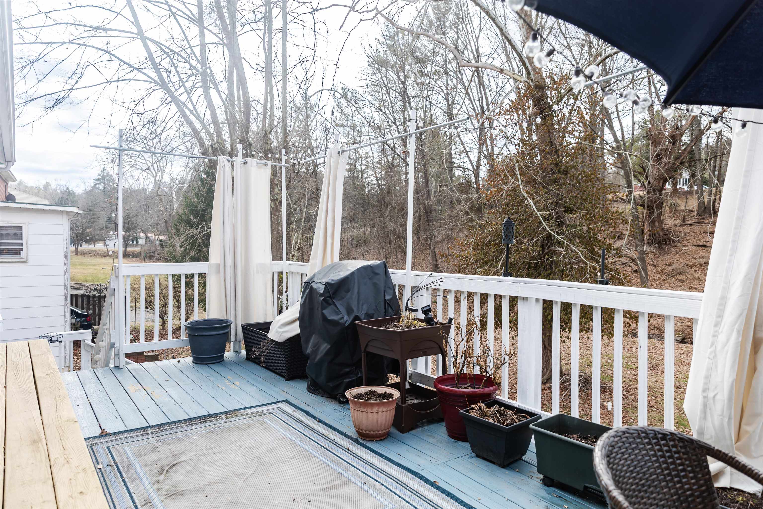 713 Thorn Hill Road Lexington, VA 24450 - Photo 39 of 45 a view of a balcony with chair and wooden floor