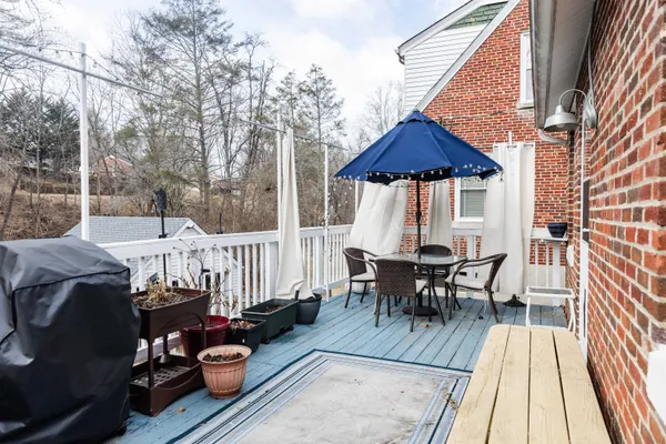 a view of a patio with wooden floor
