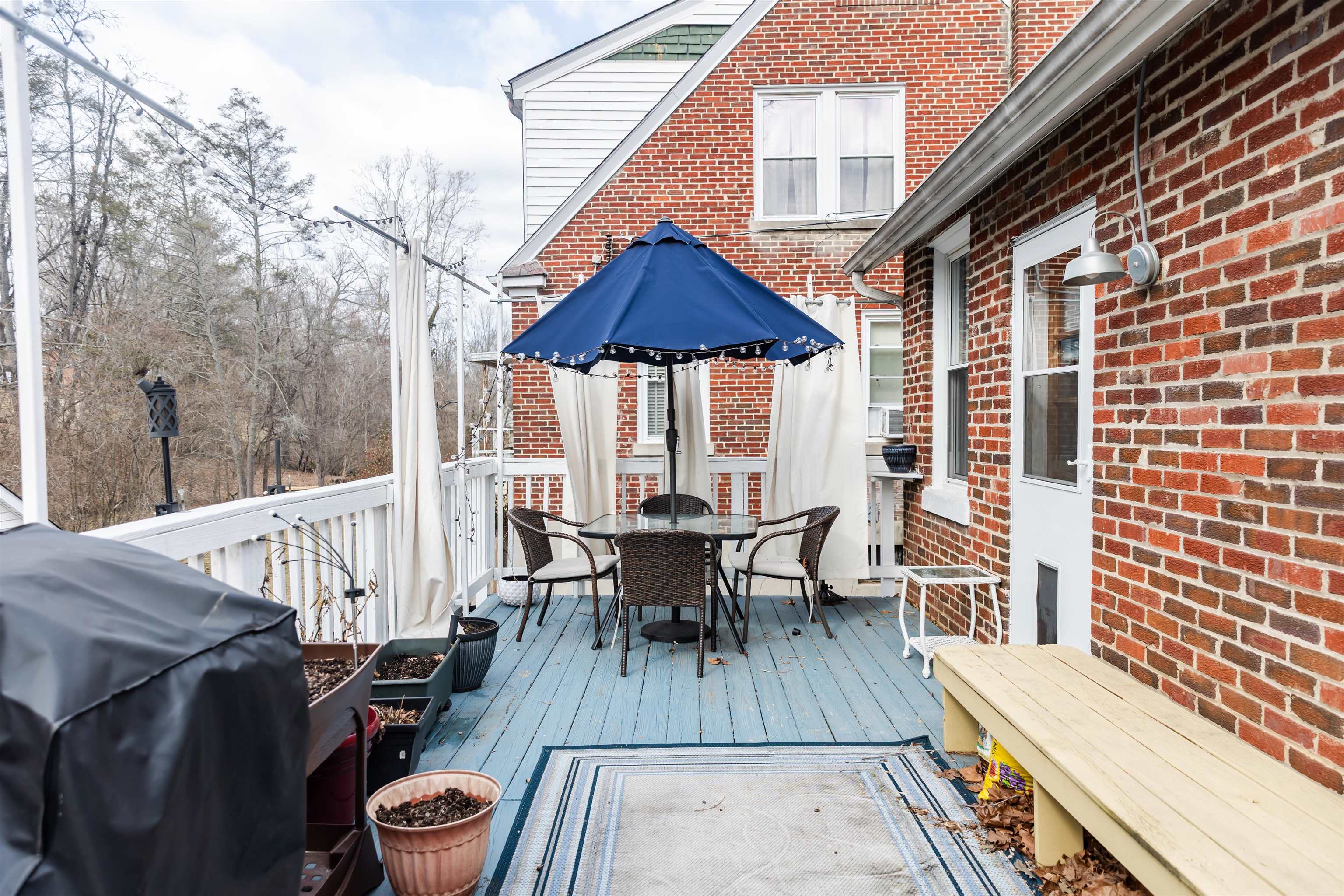 713 Thorn Hill Road Lexington, VA 24450 - Photo 41 of 45 a view of deck with table and chairs wooden floor and fence