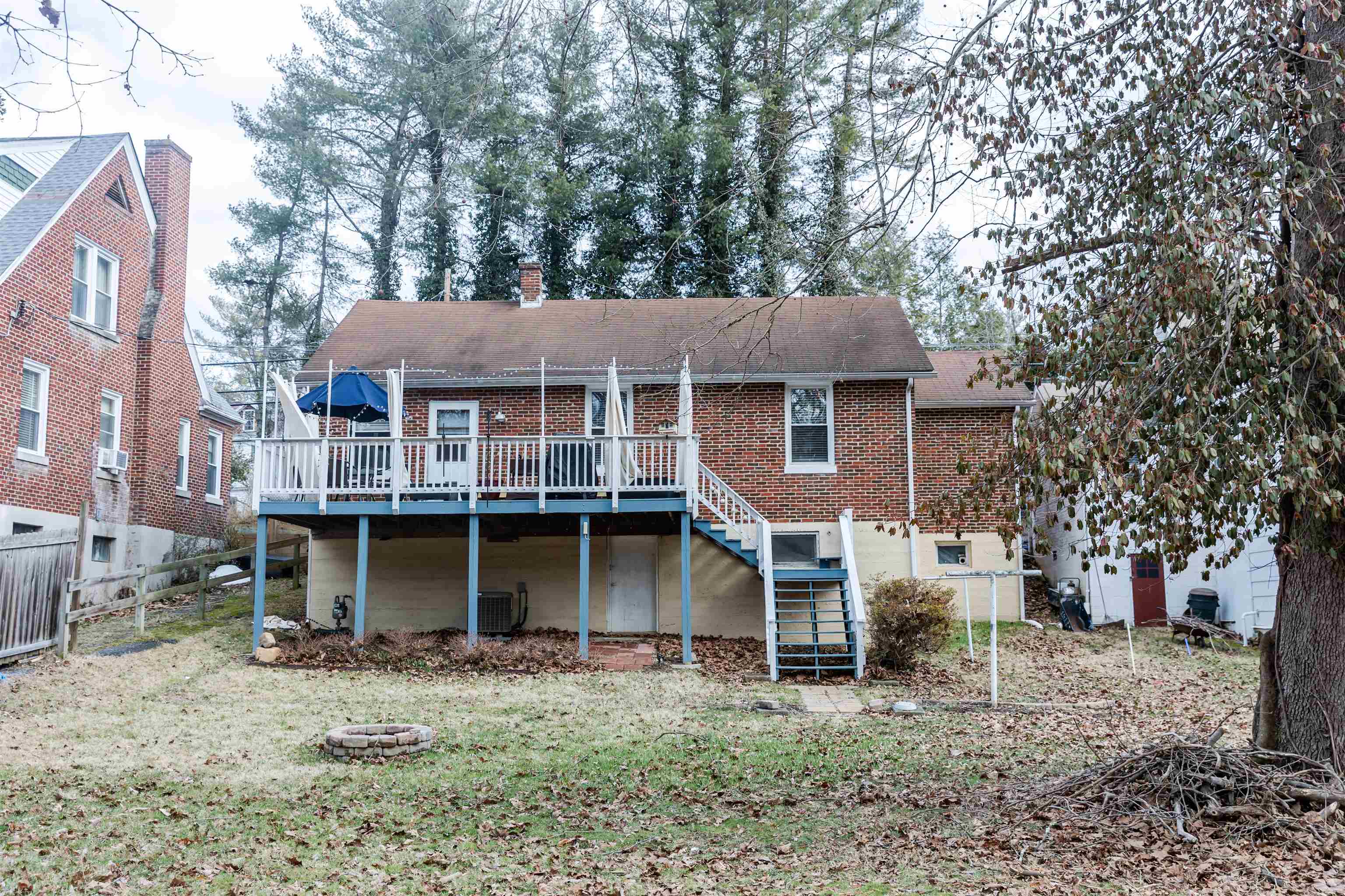 713 Thorn Hill Road Lexington, VA 24450 - Photo 7 of 45 a front view of a house with a garden and trees