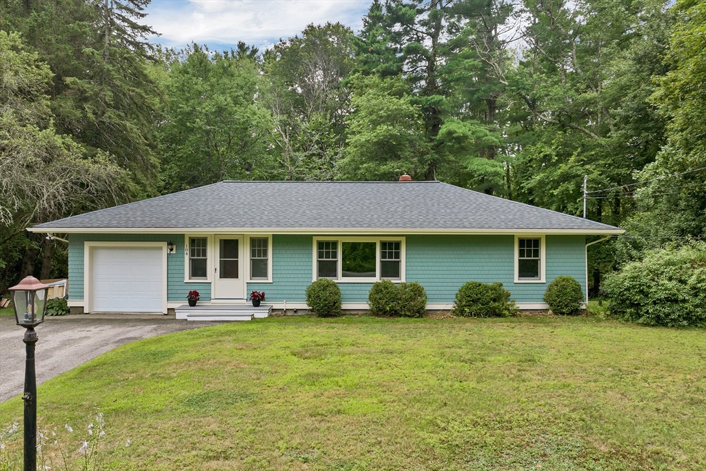 104 Kensington Road Hampton Falls, NH 03844 - Photo 1 of 42 a front view of house with yard and green space