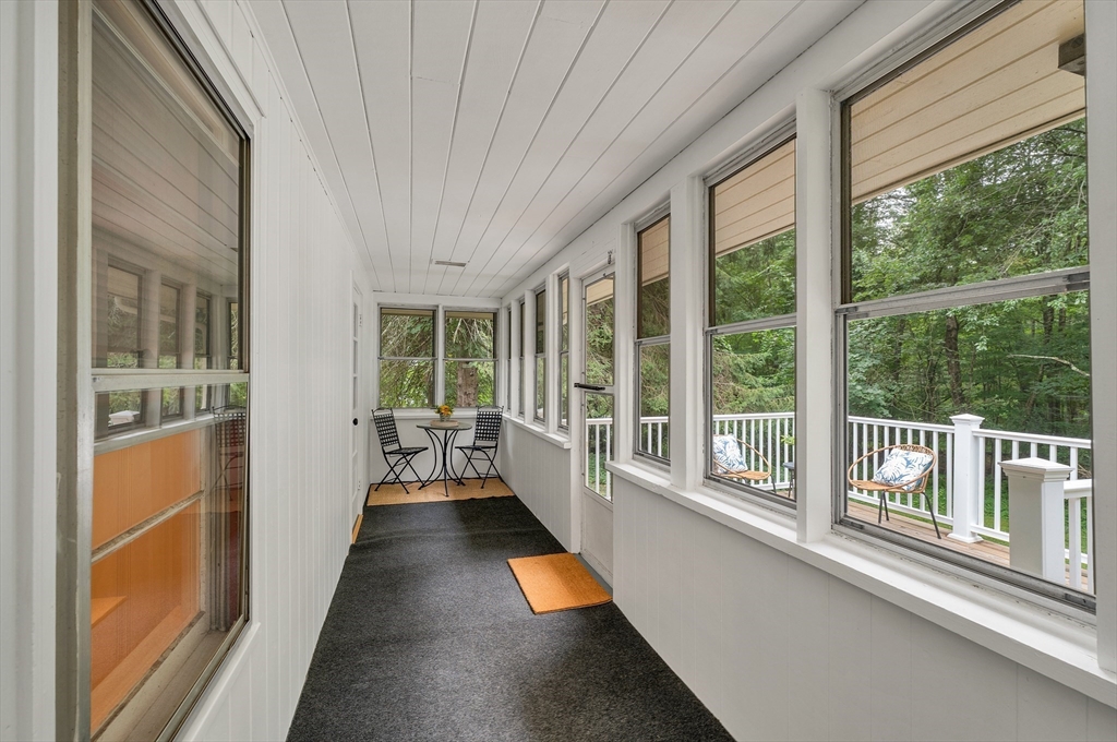 104 Kensington Road Hampton Falls, NH 03844 - Photo 13 of 42 a view of a balcony with wooden floor