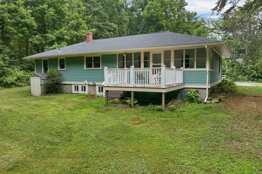 104 Kensington Road Hampton Falls, NH 03844 - Photo 18 of 42 a view of a house with a yard and sitting area