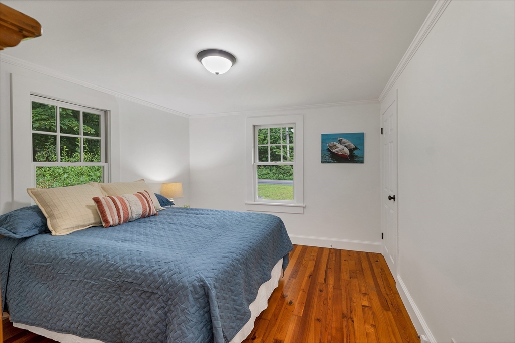 104 Kensington Road Hampton Falls, NH 03844 - Photo 23 of 42 a bedroom with a bed and a window