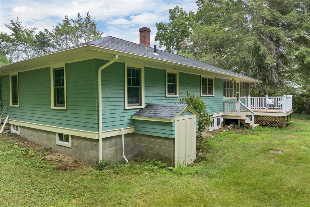 104 Kensington Road Hampton Falls, NH 03844 - Photo 34 of 42 a front view of a house with a yard