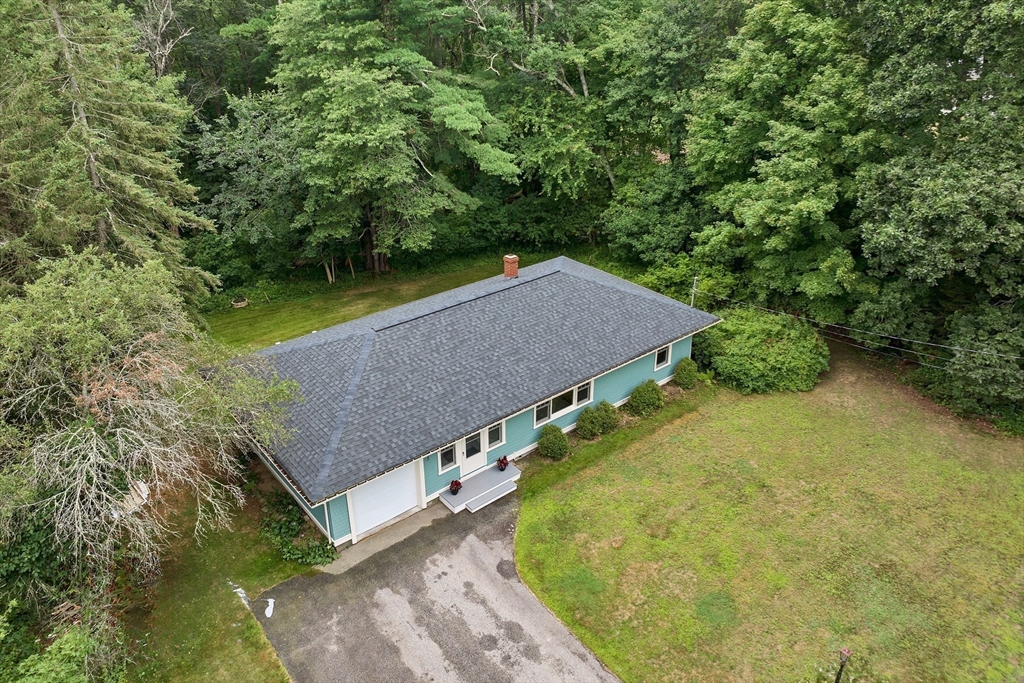 104 Kensington Road Hampton Falls, NH 03844 - Photo 37 of 42 a aerial view of a house with a yard
