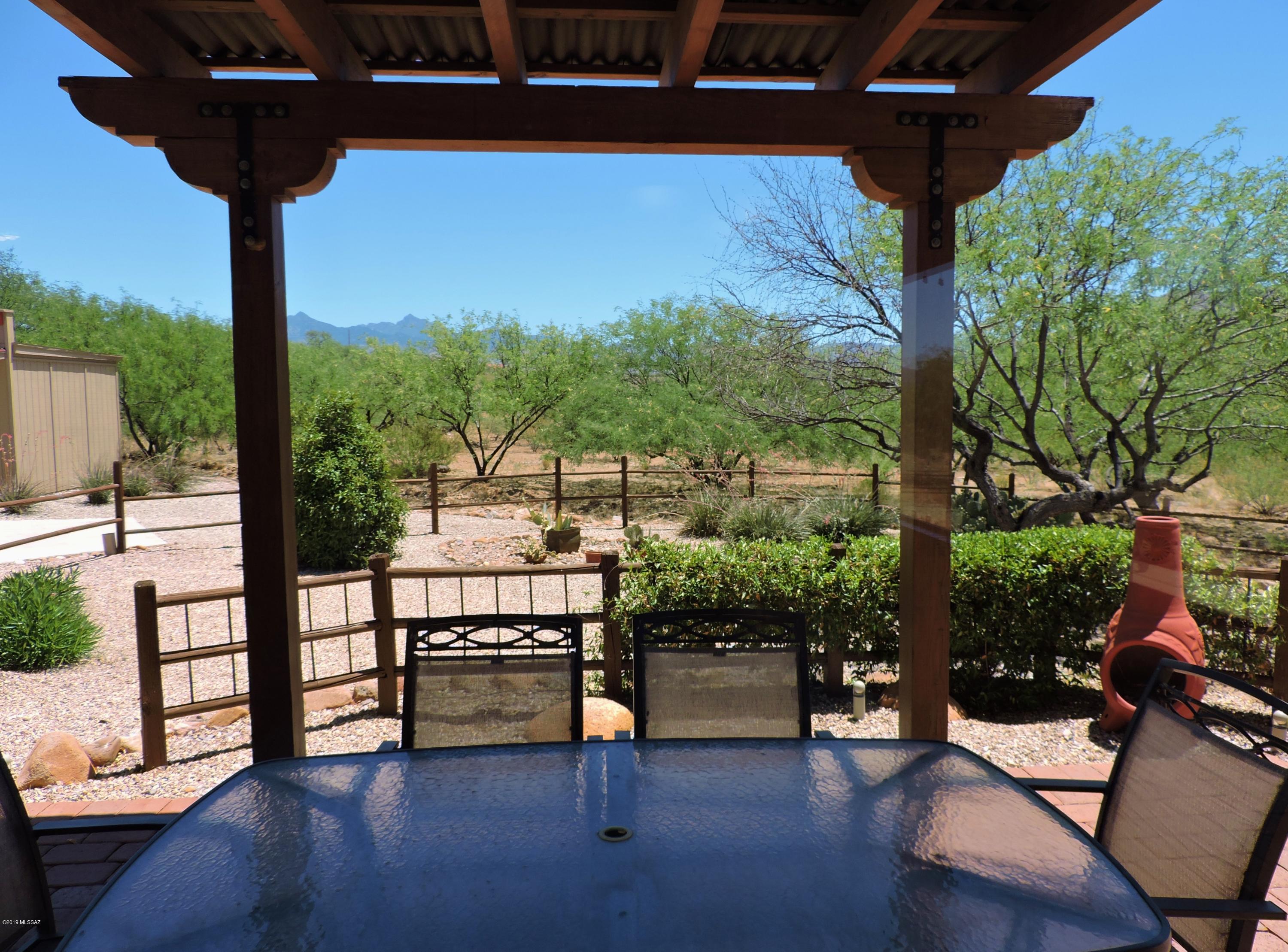 1786 Zimmer Court Rio Rico, AZ 85648 - Photo 8 of 42 a view of a terrace with couches and wooden fence