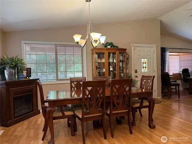 a view of a dining room with furniture window and wooden floor