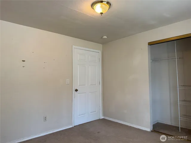 a view of a livingroom with wooden floor