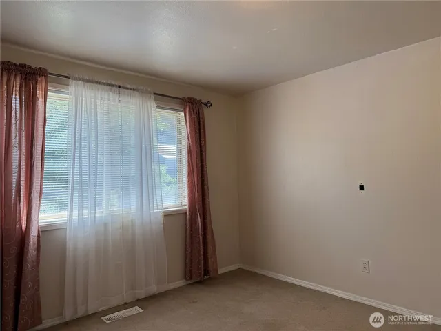 an empty room with entrance door