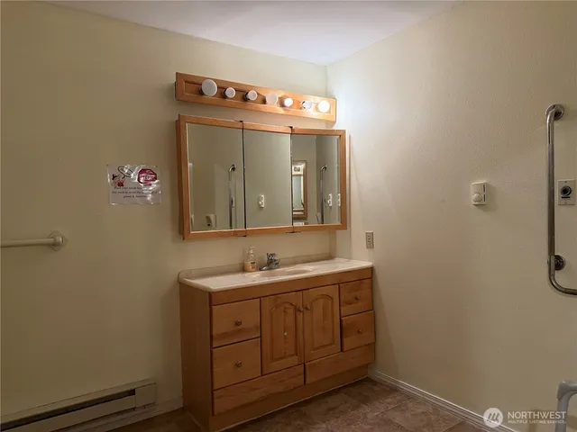 a bathroom with a sink and a mirror
