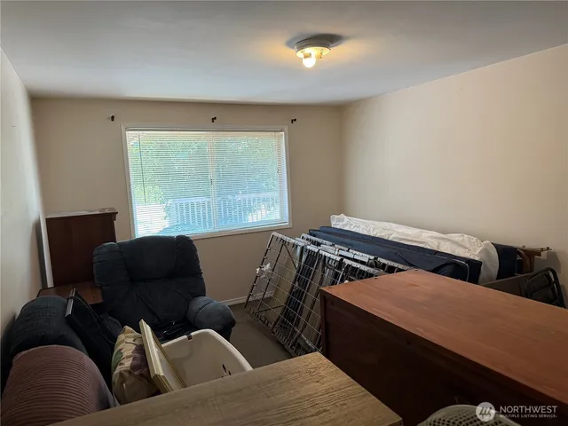 a bedroom with a bed and furniture