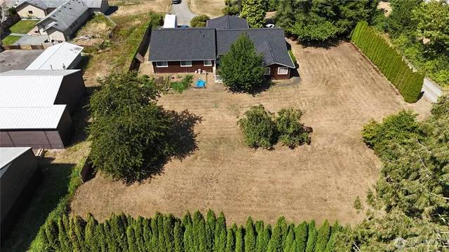 a wooden fence with trees in the background