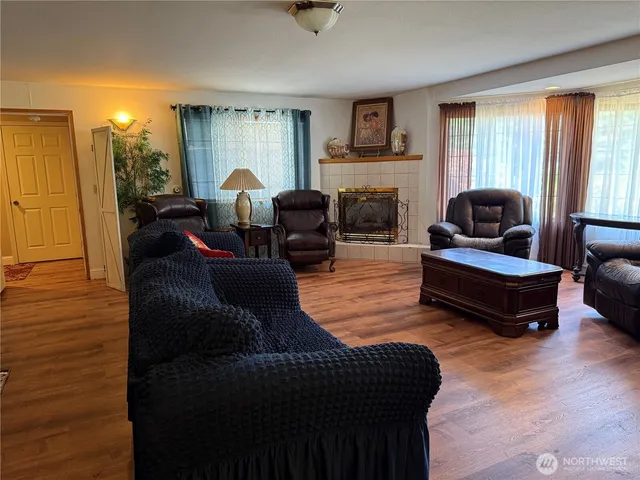 a living room with furniture and a fireplace