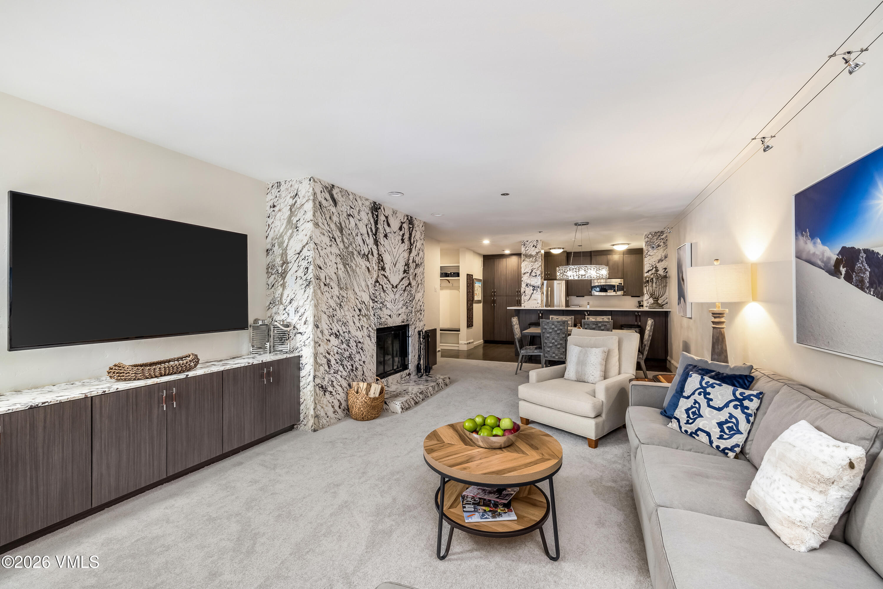 311 Offerson Road, Unit 223 Beaver Creek, CO 81620 - Photo 11 of 37 a living room with furniture and a flat screen tv