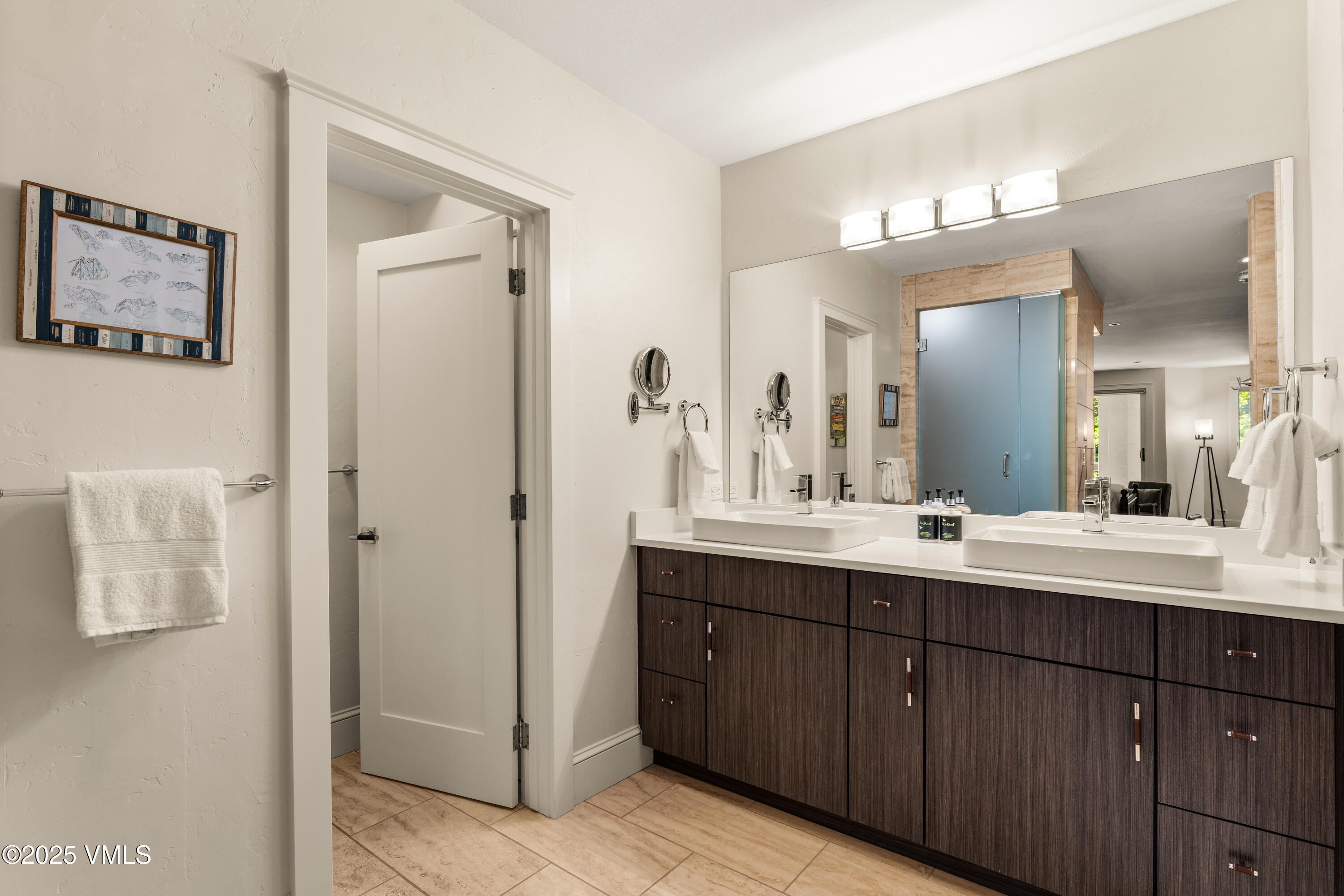 311 Offerson Road, Unit 223 Beaver Creek, CO 81620 - Photo 16 of 37 a bathroom with a double vanity sink and a mirror