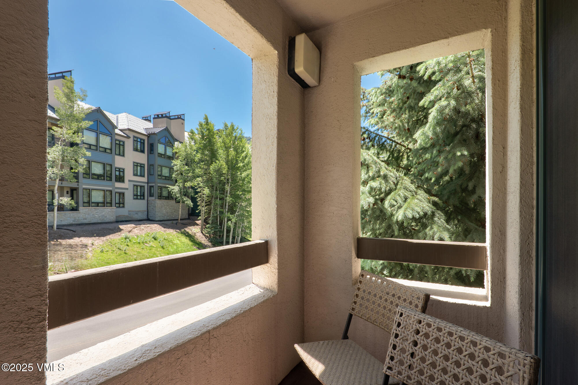 311 Offerson Road, Unit 223 Beaver Creek, CO 81620 - Photo 23 of 37 a view of a balcony with chair and table in the balcony