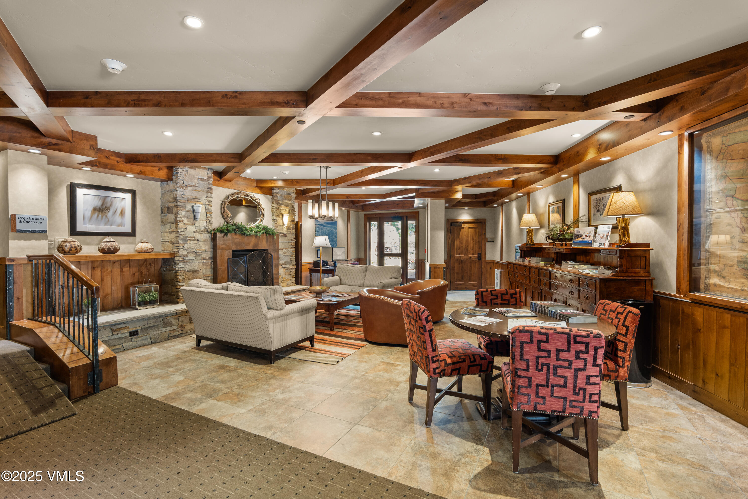 311 Offerson Road, Unit 223 Beaver Creek, CO 81620 - Photo 29 of 37 a living room with furniture and a chandelier