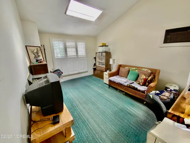 a bed room with a bed and a chair