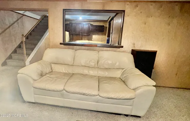 a living room with a couch and a window