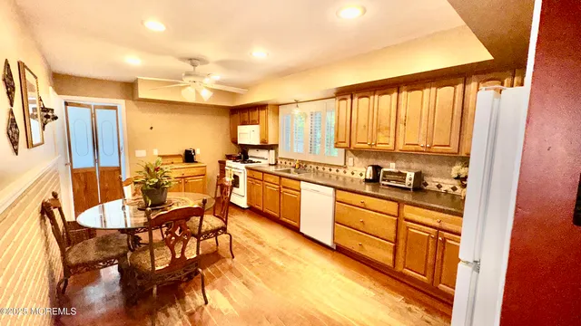 a kitchen with stainless steel appliances a sink and cabinets