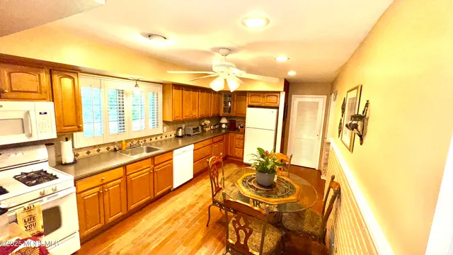 a spacious bathroom with a double vanity sink and a mirror