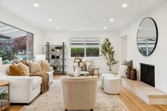a view of a dining room with furniture window and wooden floor