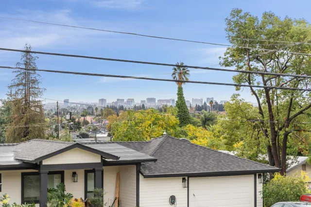 a kitchen with stainless steel appliances a refrigerator and a stove top oven