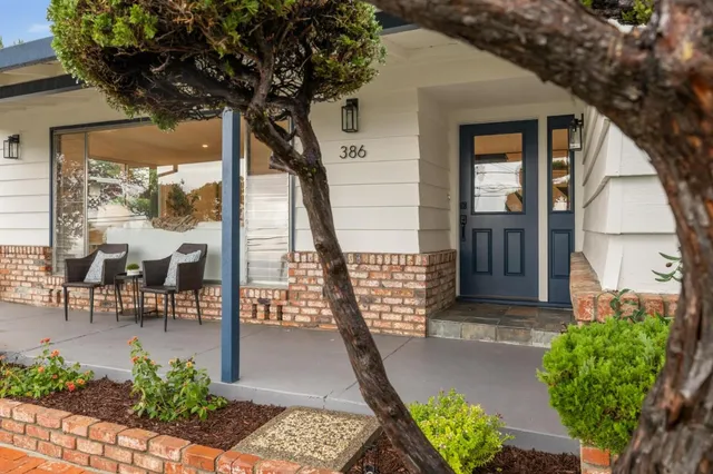 a view of a livingroom with furniture and a fireplace