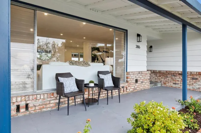 a view of a livingroom with furniture and a fireplace
