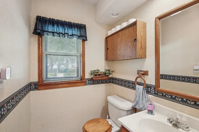 a bathroom with a toilet a sink and a bathtub